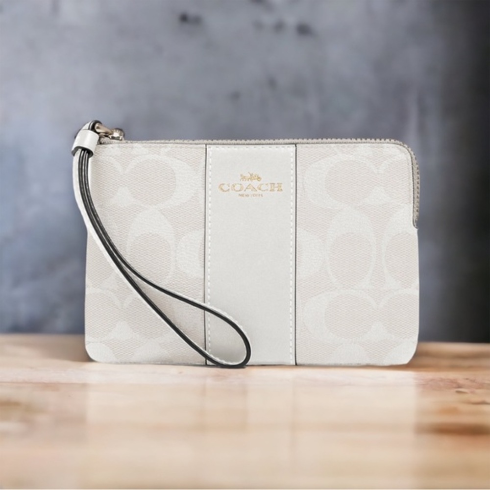 Coach Corner Zip Wristlet In Signature Canvas